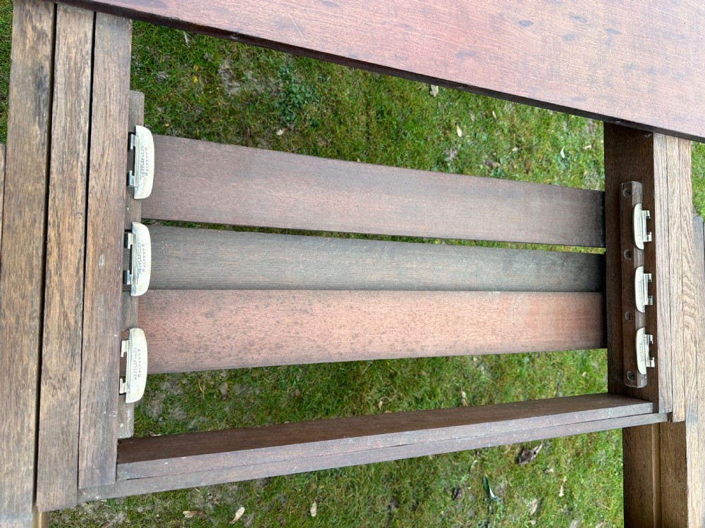 A rectangular mahogany extending dining table from the William IV period with fluted turned legs and brass castors. View IX