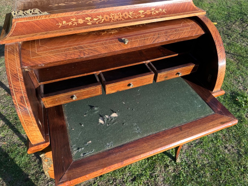 A 19th-century French cylinder roll-top desk crafted with floral marquetry inlays, slender cabriole legs, and brass ormolu mounts. View VII