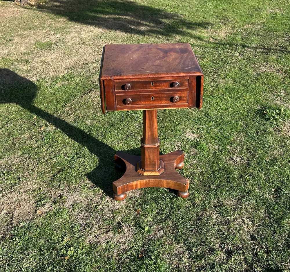 A 19th-century mahogany Pembroke table featuring two drawers, two folding drop leaves, a central pedestal column, and a shaped quadform base. View II