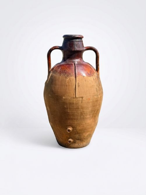 fig 1. A large 19th-century Italian terracotta wine jar featuring two loop handles, a dark brown glazed upper neck, and an unglazed buff earthenware body.