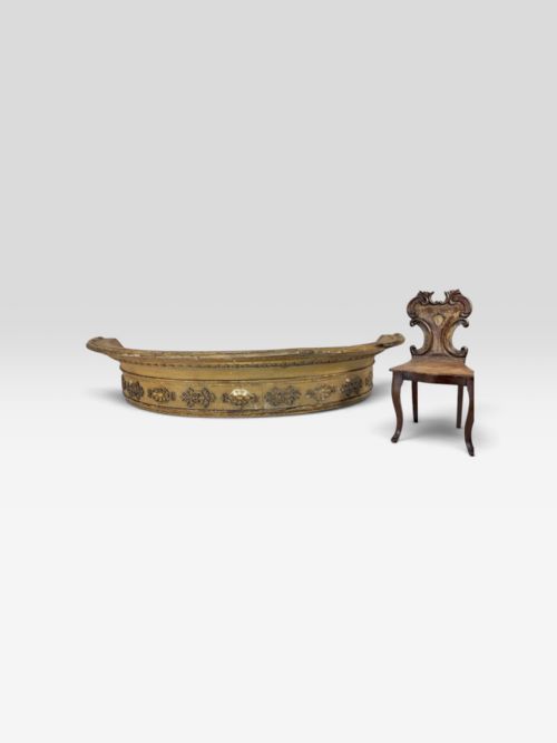 fig 1. A curved 19th-century giltwood window pelmet decorated with carved rosette frieze mouldings.