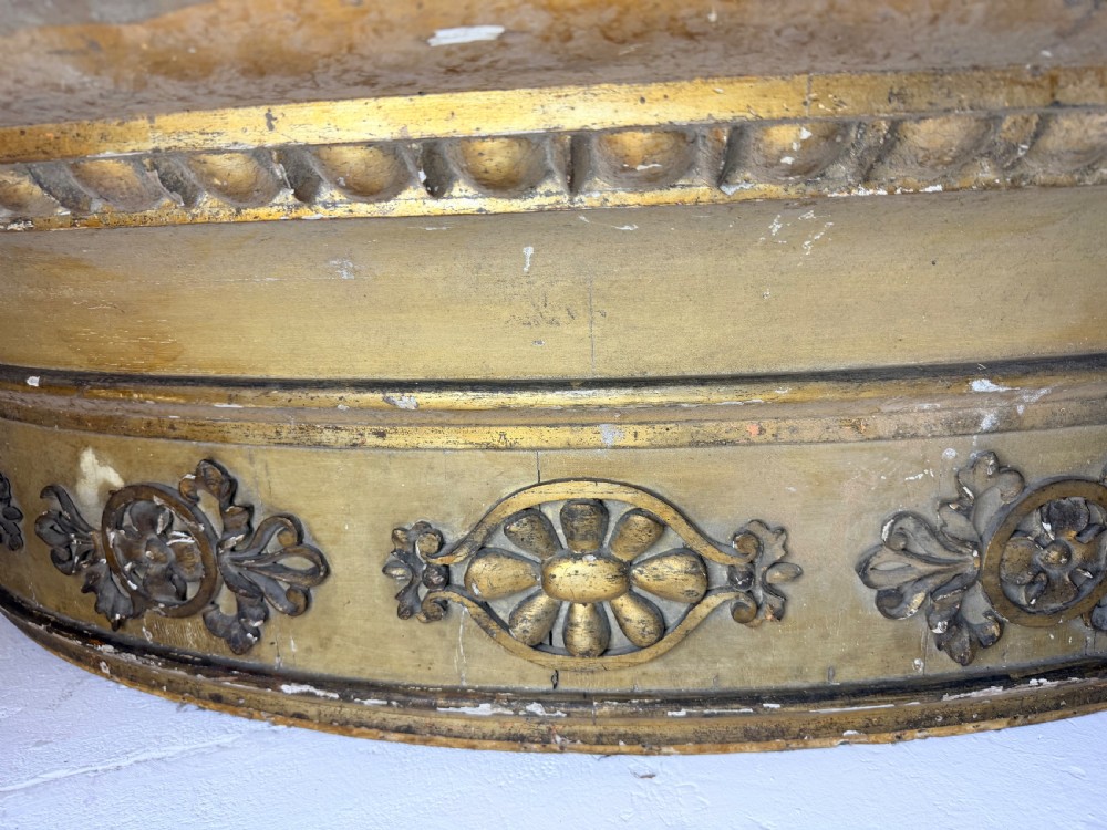 A large curved 19th-century carved timber and gilded window pelmet decorated with floral rosettes and egg-and-dart moulding. View VI