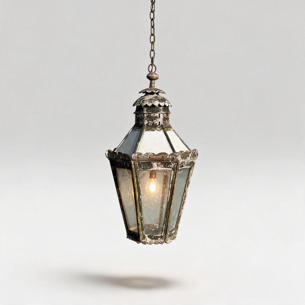 A 19th-century hexagonal hanging lantern made from patinated copper with clear glass panels, suspended by an iron chain.