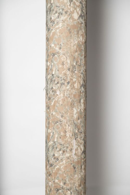 fig 1. A set of four tall cylindrical architectural columns featuring a faux-marble finish, moulded gold-toned capitals, and square grey plinths.