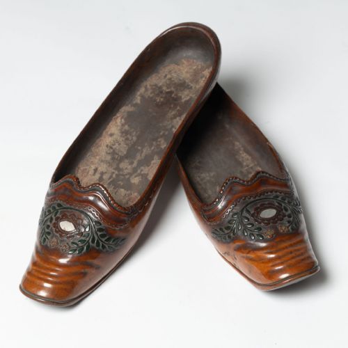 Pair of antique shoes, carved wood