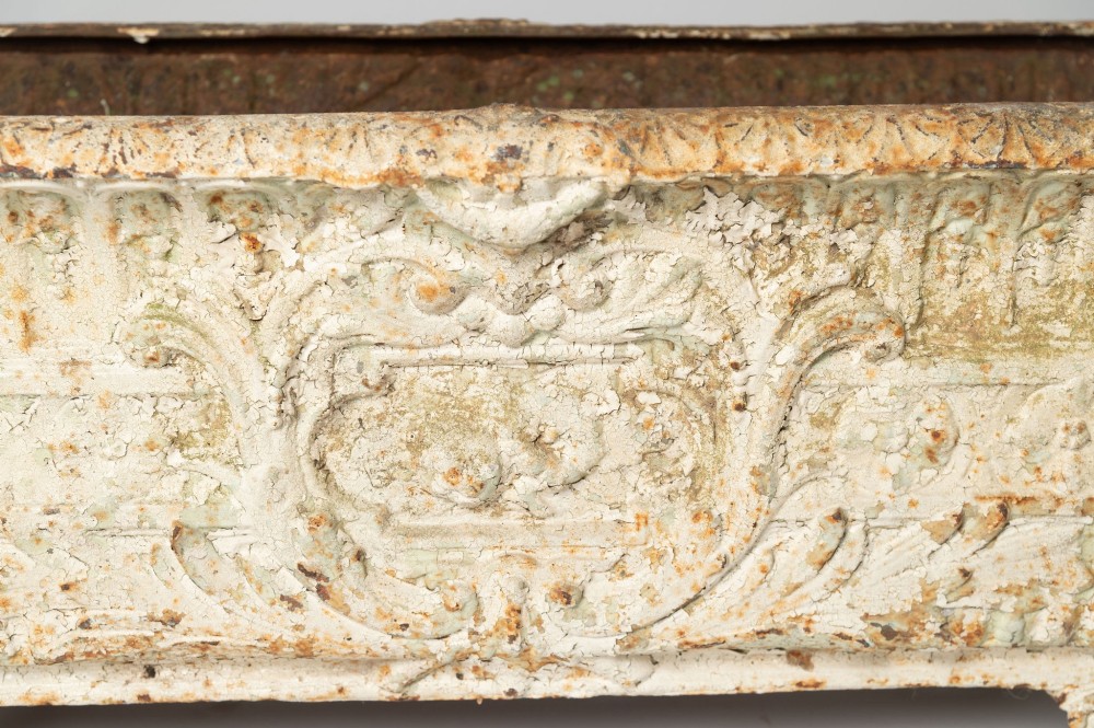 A 19th-century French rectangular cast iron planter featuring distressed off-white paint, detailed acanthus leaf relief, and short paw feet. View II