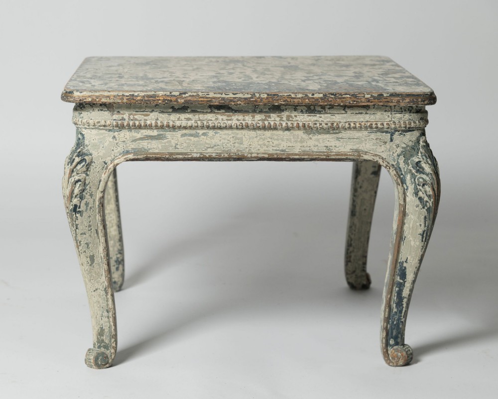 A square antique French side table featuring weathered grey and blue paint, carved cabriole legs, and bead moulding along the apron. View II