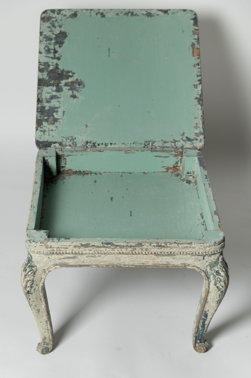 A square antique French side table featuring weathered grey and blue paint, carved cabriole legs, and bead moulding along the apron. View IV