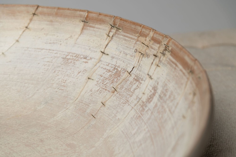 A wide, shallow antique Swedish wooden dairy bowl with a pale, scrubbed timber finish and subtle turned rim lines. View VI