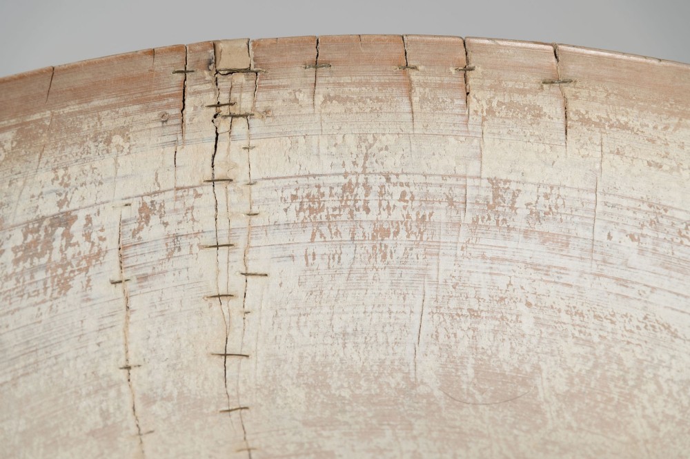A wide, shallow antique Swedish wooden dairy bowl with a pale, scrubbed timber finish and subtle turned rim lines. View VII
