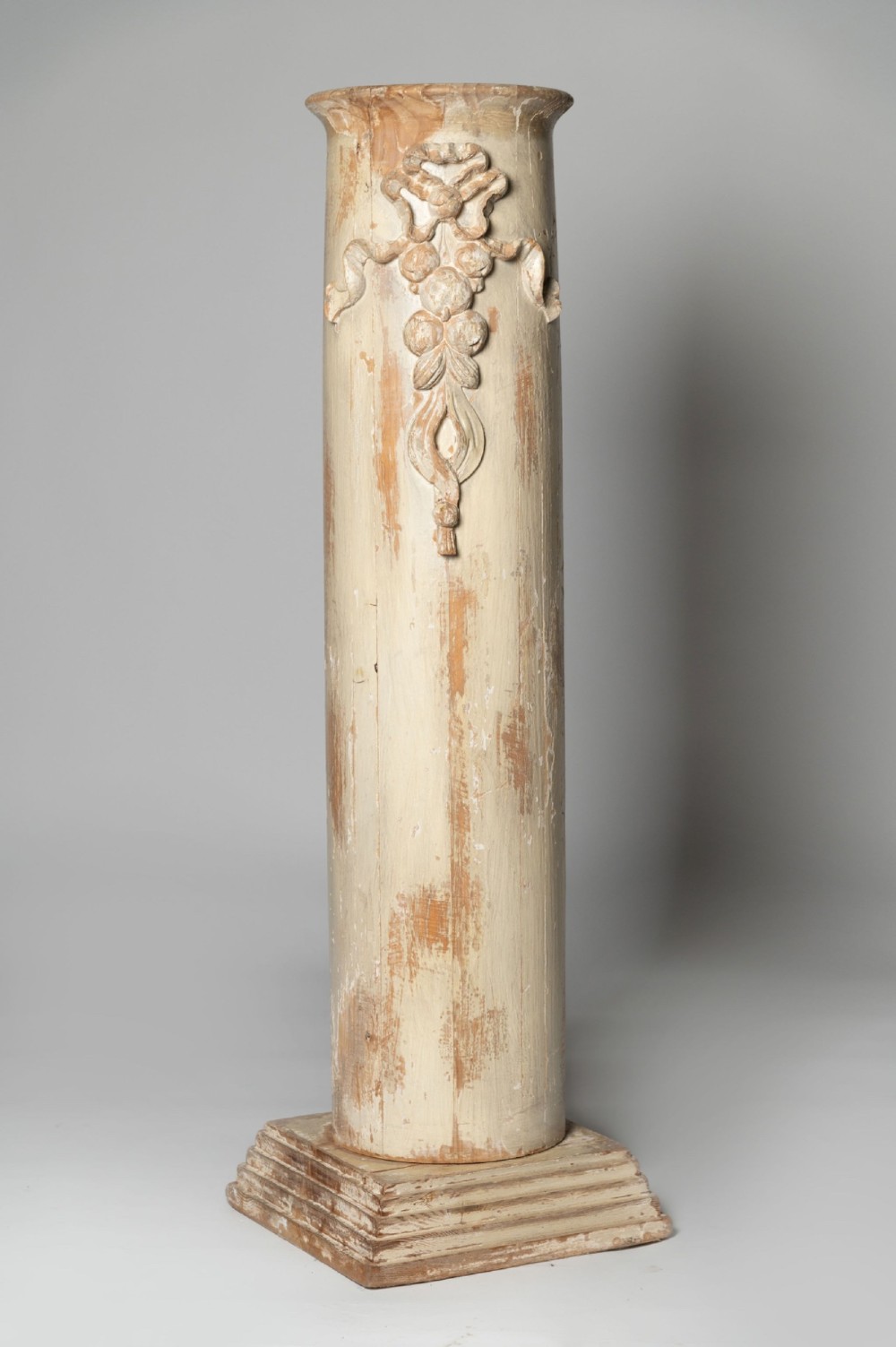 An antique nineteenth-century Swedish painted wooden column featuring a carved ribbon motif and a stepped square plinth base.