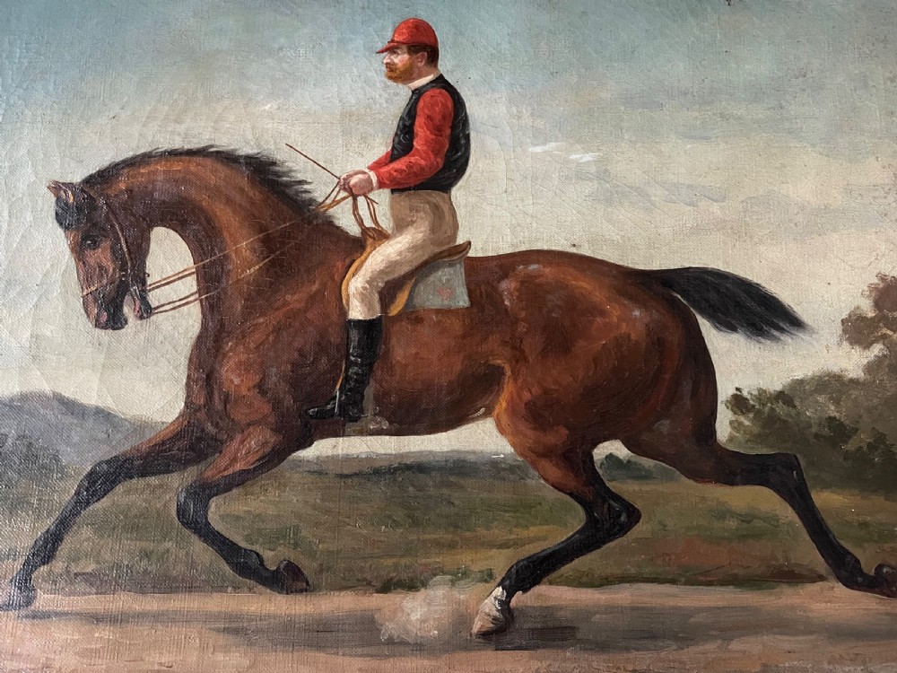 A 19th-century oil painting on canvas depicting a jockey in red and black attire riding a bay horse across a landscape under a blue sky. View II