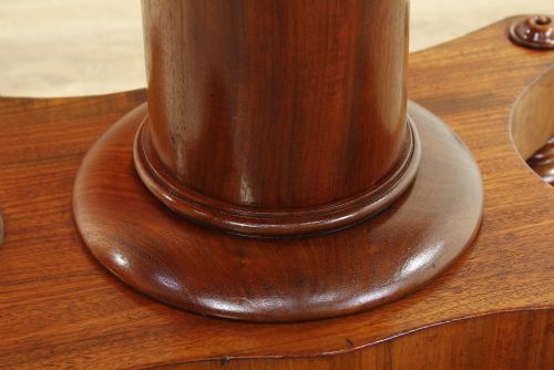 fig 1. A Georgian satin walnut pedestal tea table featuring a rectangular fold-over top, a scalloped apron, a turned cylindrical column, and a four-pointed plinth base on flattened ball feet.