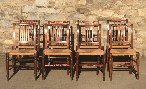 fig 1. Harlequin Set of 8 Antique Country Dining Chairs with Rush Seats