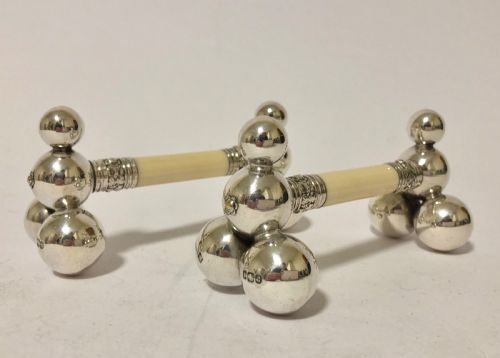 Pair of Antique Silver and Ivory Knife Rests
