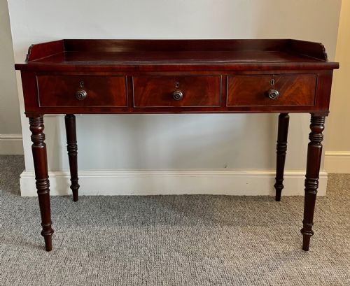 fig 1. Regency Mahogany Three Drawer Table