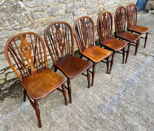 fig 1. Set of Six Antique Elm Seated Wheelback Chairs