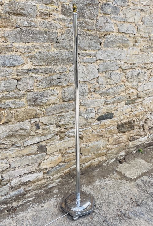 fig 1. An Art Deco chrome standard lamp featuring a vertical fluted column set upon a polished hexagonal base.