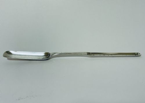 fig 1. A Georgian Irish sterling silver double-ended marrow scoop resting horizontally against a plain white background.
