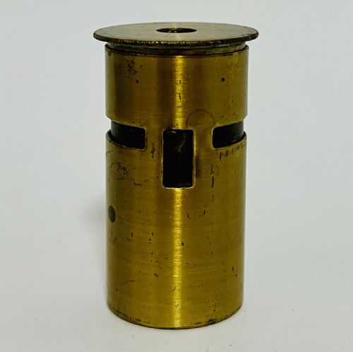fig 1. A compact cylindrical brass pocket microscope featuring a side specimen slot and top viewing lens with natural surface patination.