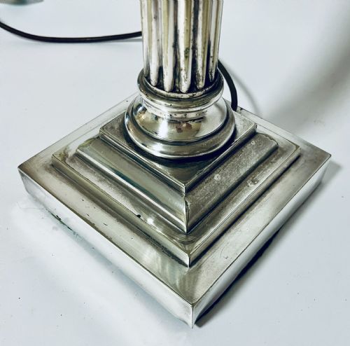fig 1. A Victorian silver-plated table lamp designed as a fluted Corinthian column with a stepped square base.