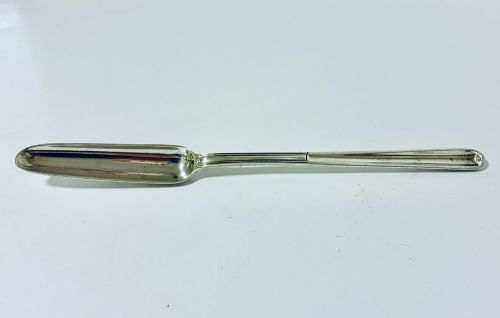 fig 1. An elongated Georgian silver marrow scoop featuring a deep concave channel end tapering along a linear stem.