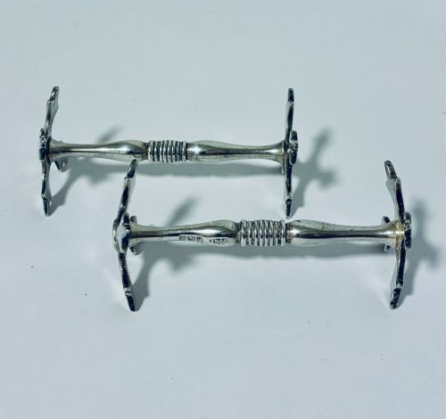 PAIR OF ANTIQUE SILVER KNIFE RESTS
