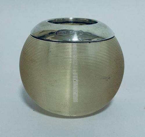 fig 1. A spherical clear ribbed glass match striker featuring a polished hallmarked silver rim at the top opening.