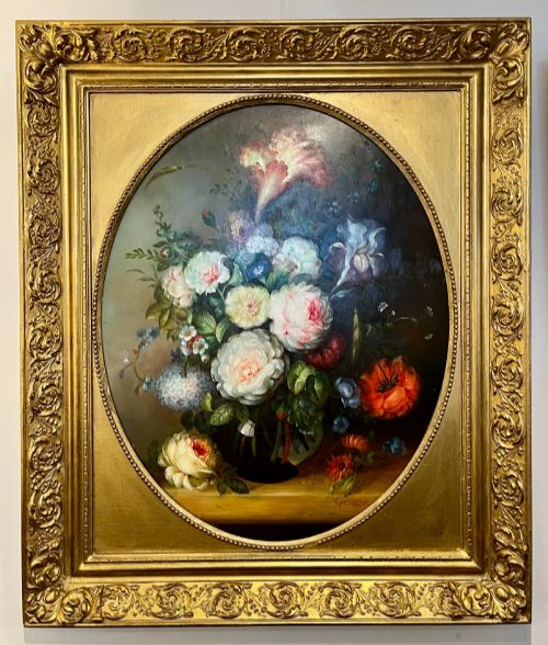 fig 1. A pair of oil paintings on board featuring floral bouquets framed within oval apertures inside ornate gold frames.