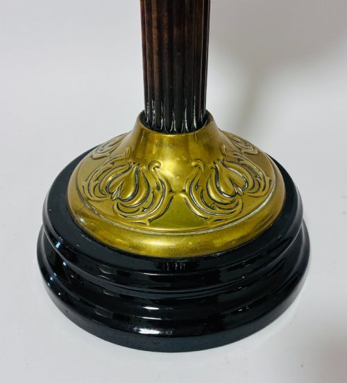 fig 2. A Victorian oil lamp featuring an etched frosted glass shade, a turquoise enamelled font, and a brass column on a dark stepped base.