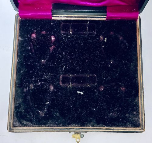 fig 3. A cased set of four Victorian shell-shaped silver salt cellars with gilded interiors and two matching silver spoons in a velvet-lined box.
