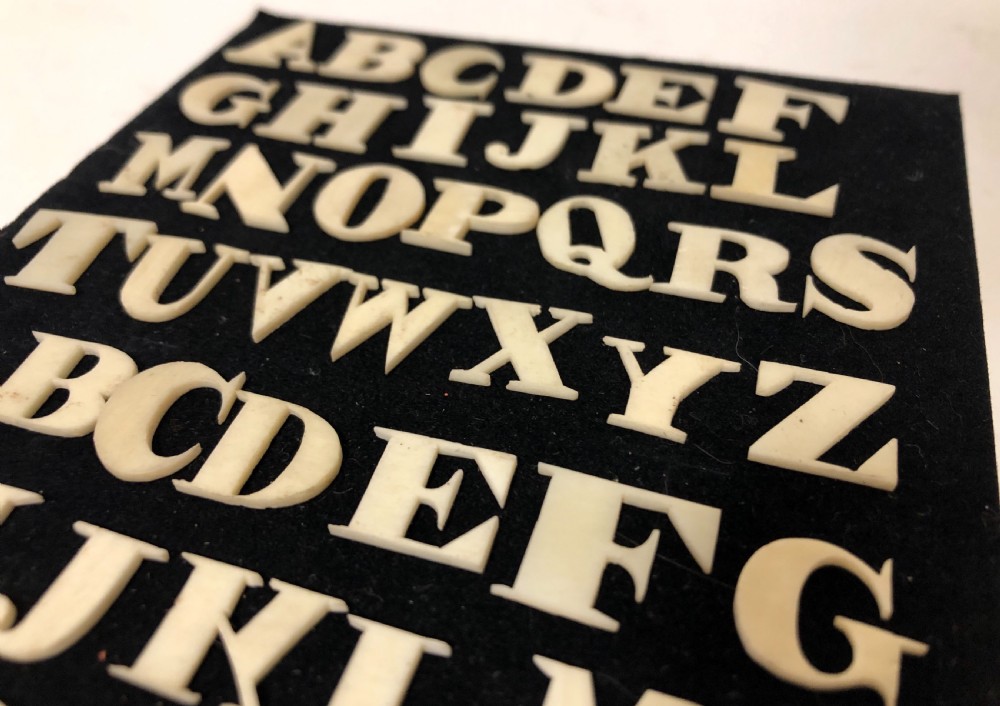 Set of Antique Bone Spelling Alphabet Letters View III