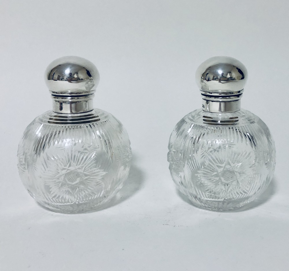 Pair of Antique Cut Glass Scent Bottles with Silver Tops