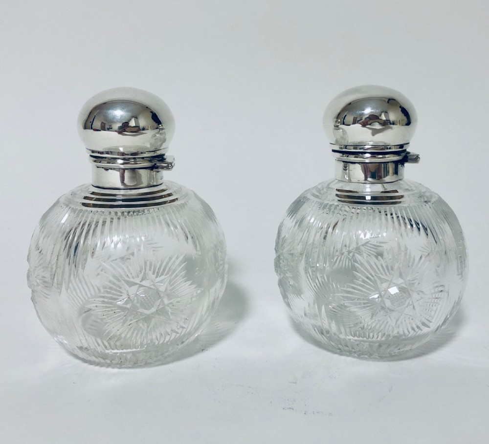 Pair of Antique Cut Glass Scent Bottles with Silver Tops View III