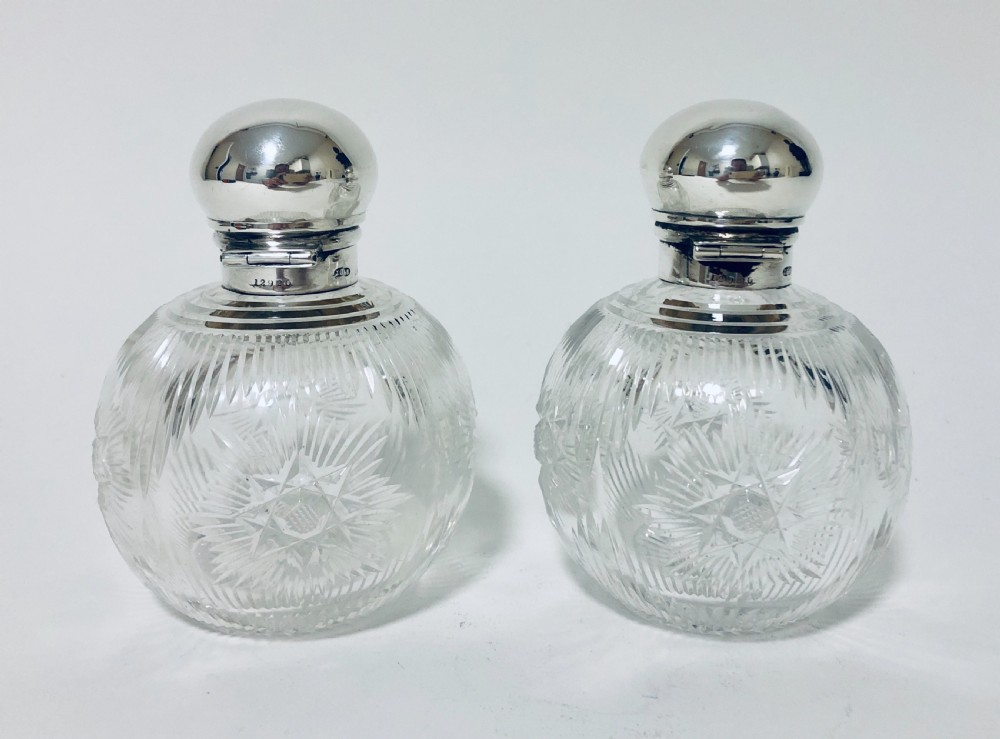 Pair of Antique Cut Glass Scent Bottles with Silver Tops View V