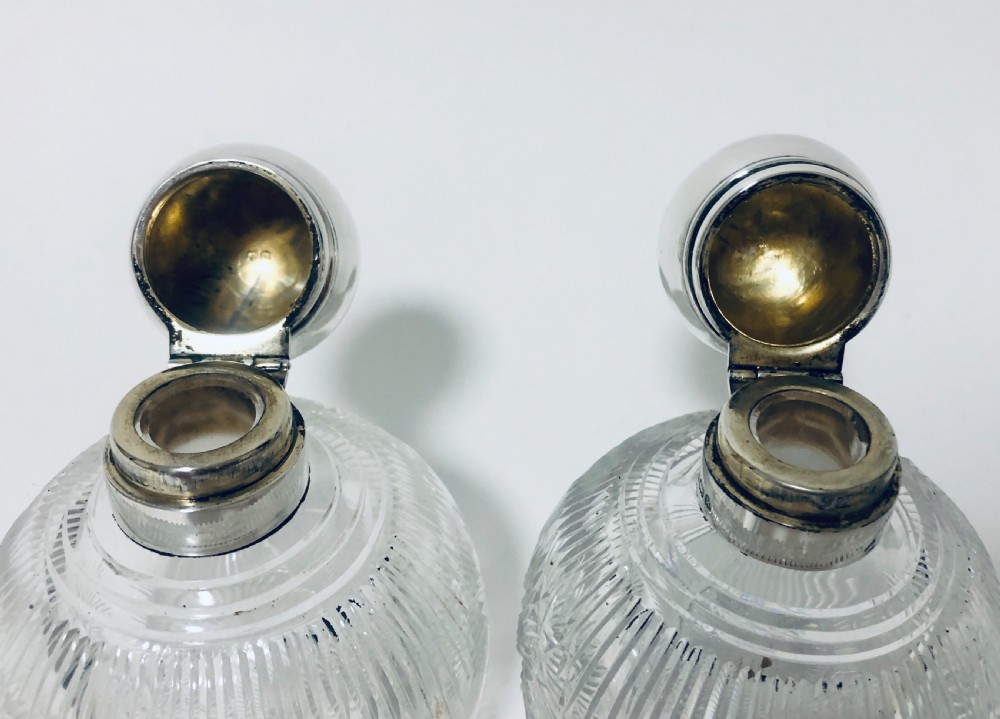 Pair of Antique Cut Glass Scent Bottles with Silver Tops View IX
