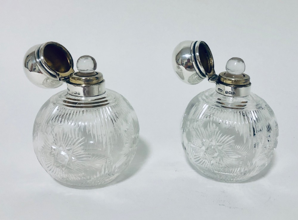 Pair of Antique Cut Glass Scent Bottles with Silver Tops View X