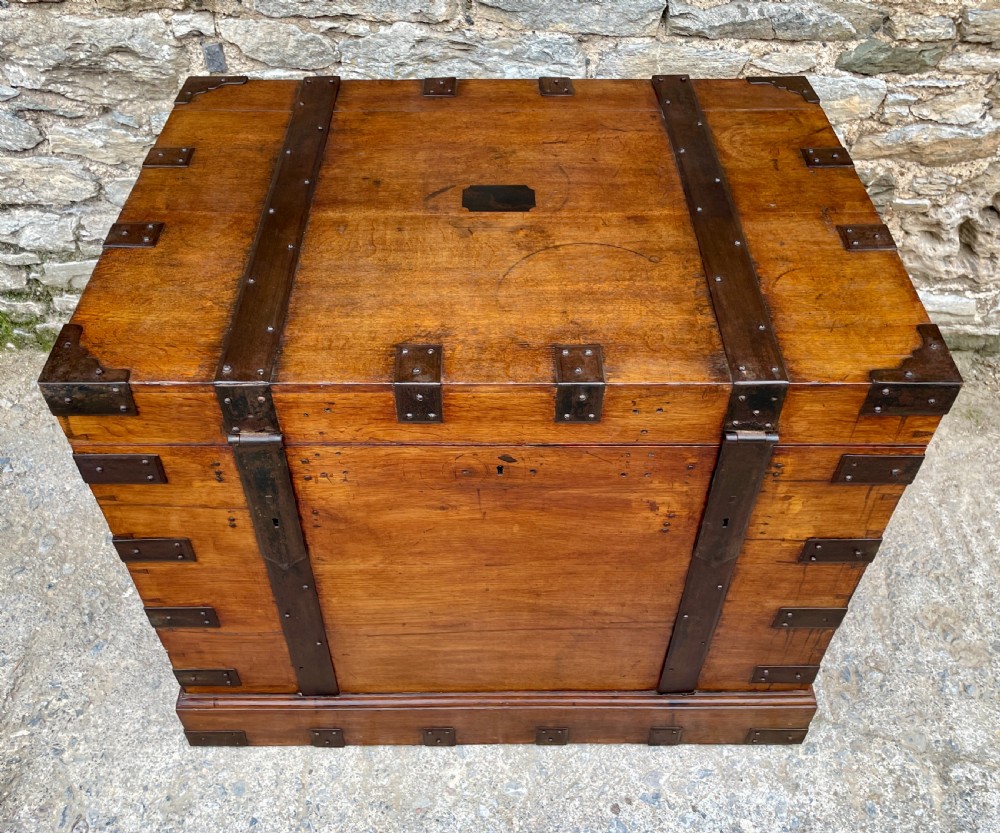 A large Victorian warm brown oak silver chest featuring dark iron straps, corner brackets, and a central keyhole. View III