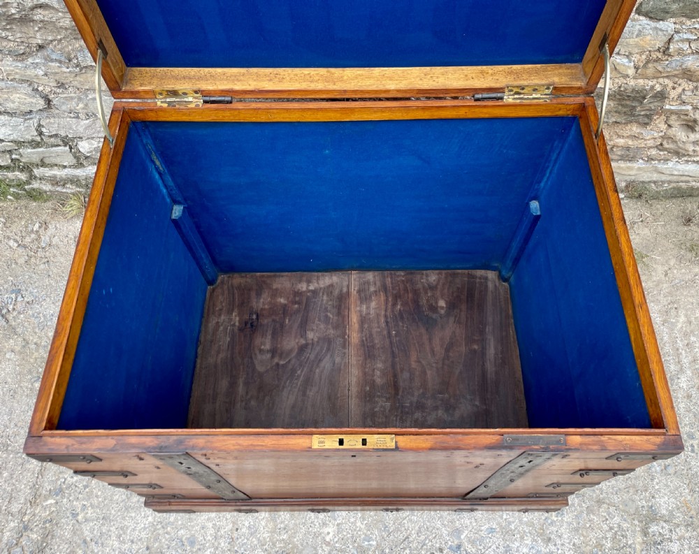 A large Victorian warm brown oak silver chest featuring dark iron straps, corner brackets, and a central keyhole. View XXI