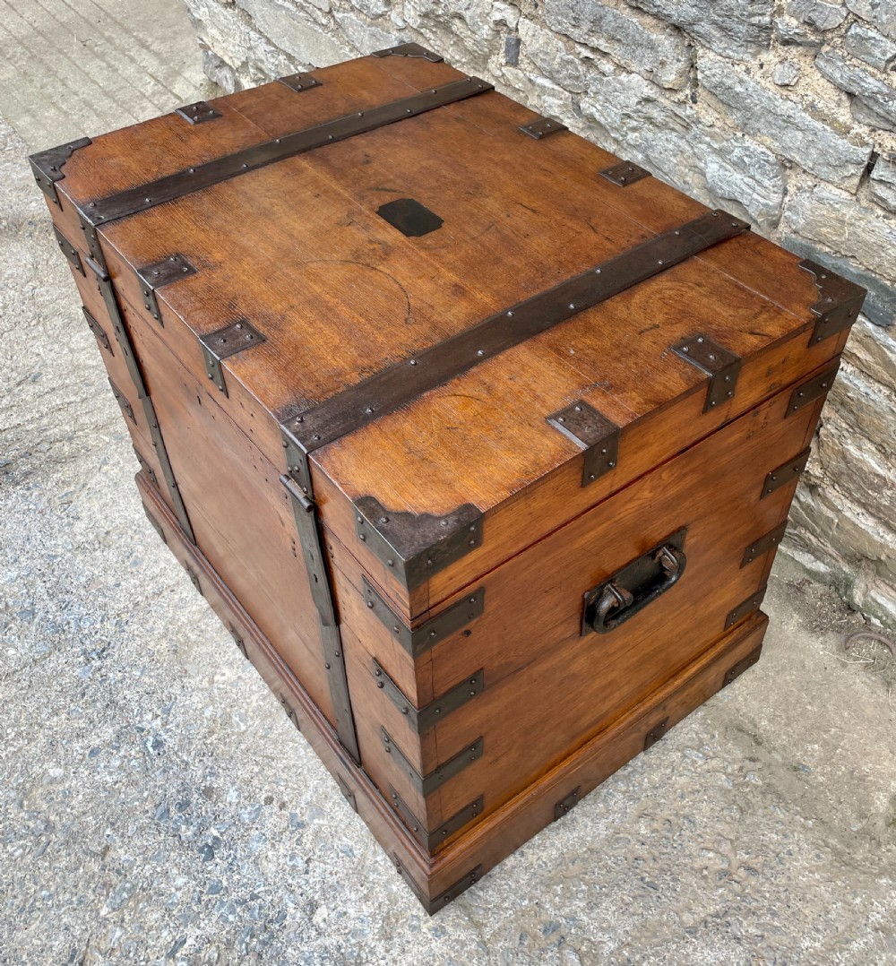 A large Victorian warm brown oak silver chest featuring dark iron straps, corner brackets, and a central keyhole. View XXVI