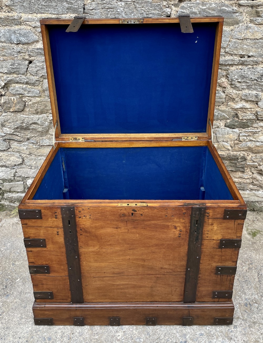 A large Victorian warm brown oak silver chest featuring dark iron straps, corner brackets, and a central keyhole. View XXVII