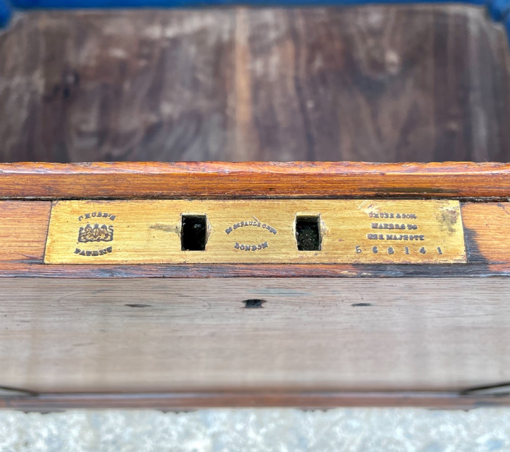 A large Victorian warm brown oak silver chest featuring dark iron straps, corner brackets, and a central keyhole. View XXXI