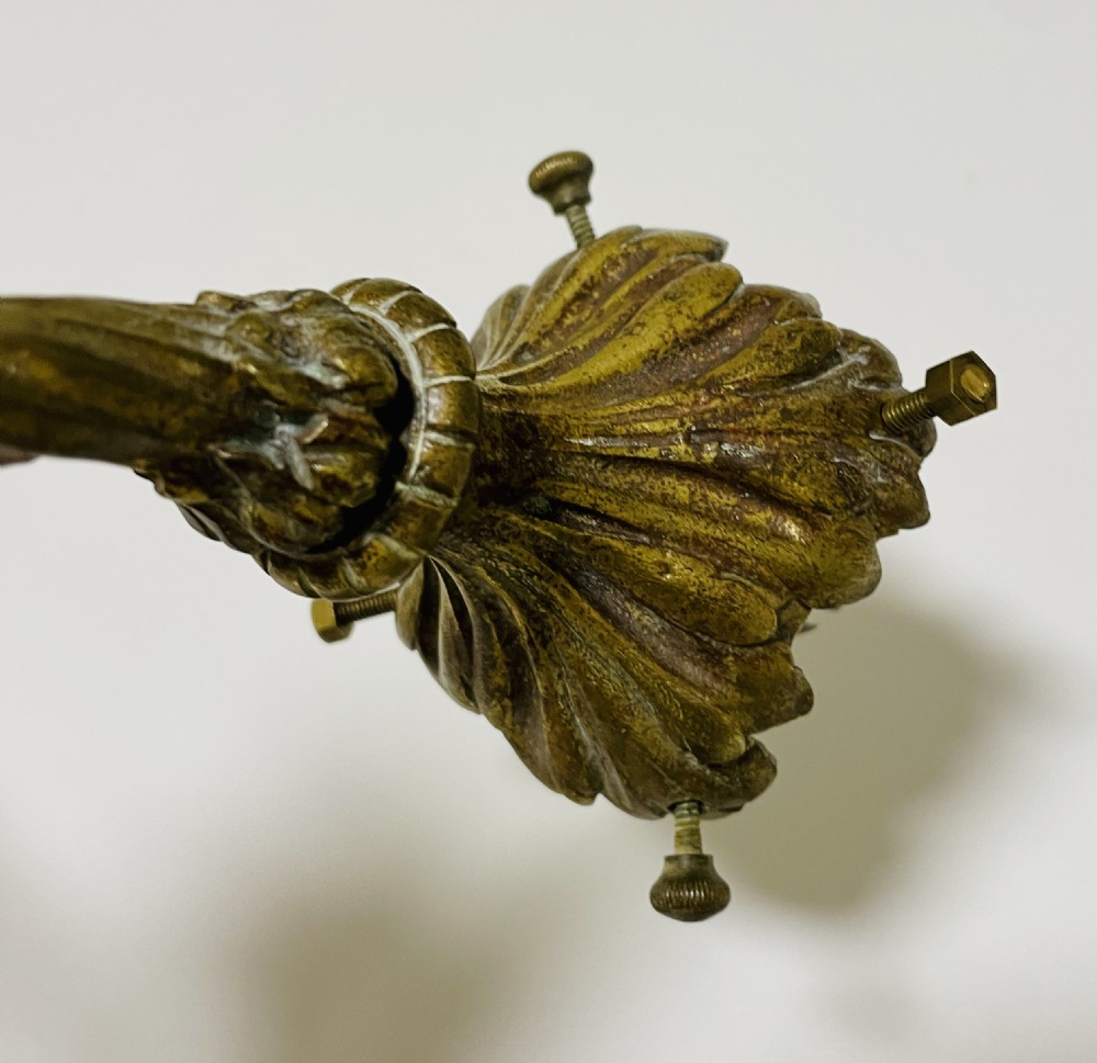 A Victorian twin-arm gilt brass wall sconce featuring reeded details, acanthus leaf motifs, and frosted frilled glass shades with etched floral patterns. View XII