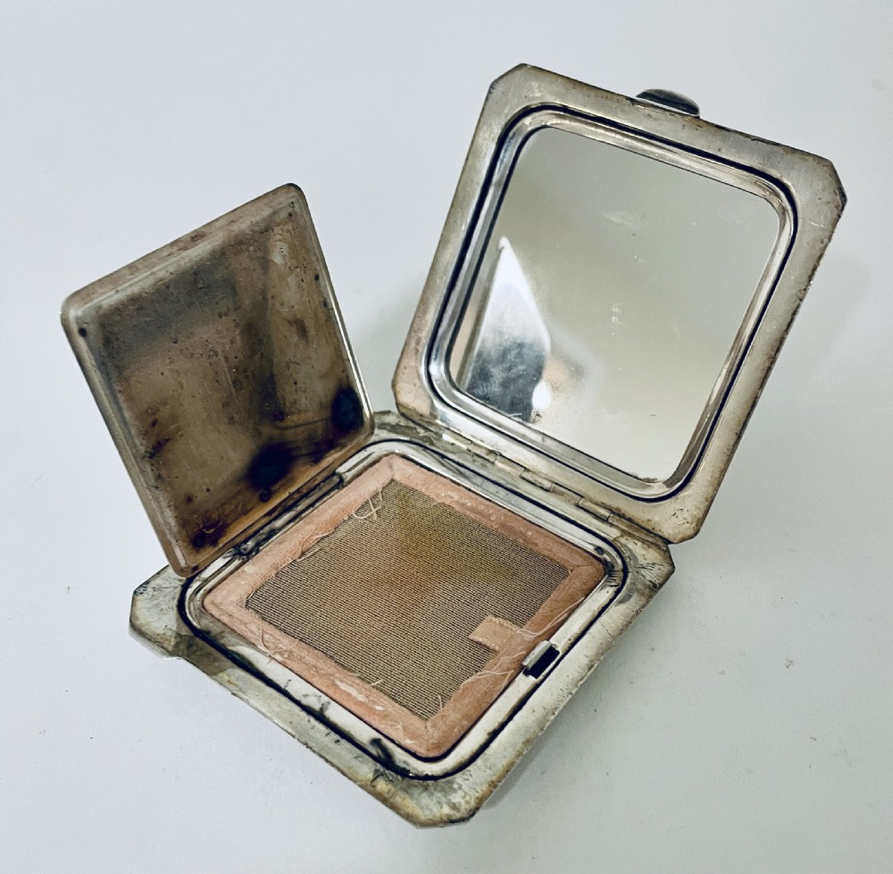 Silver Compact View IX