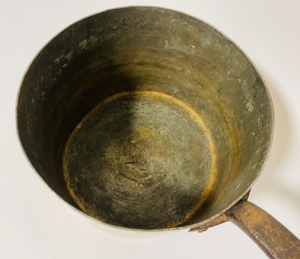 A large Victorian copper saucepan with a flat copper lid and a long dark cast iron handle. View XIII