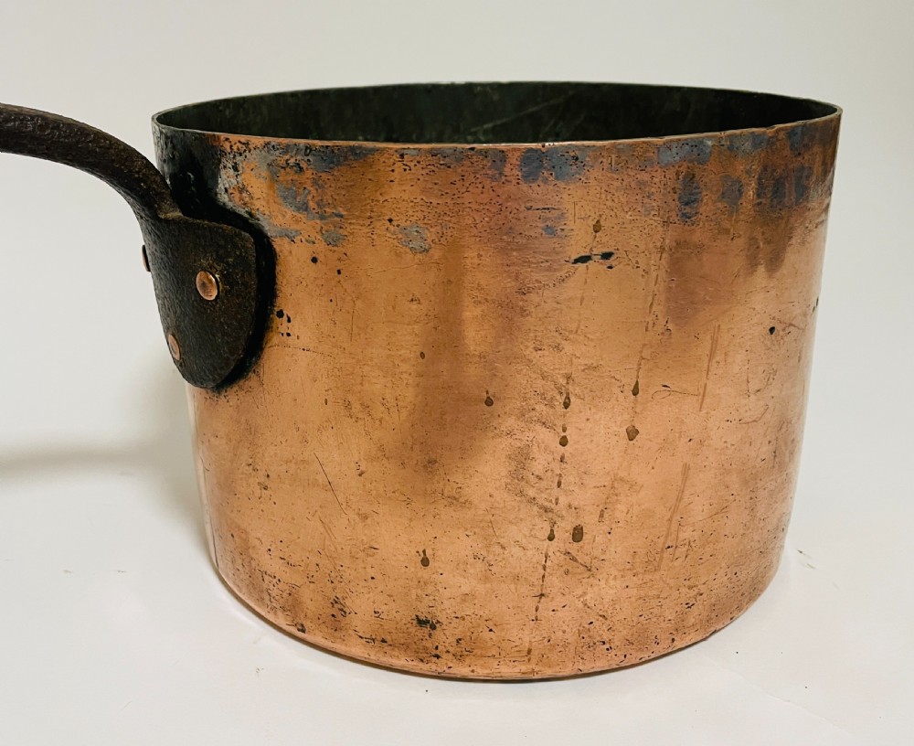 A large Victorian copper saucepan with a flat copper lid and a long dark cast iron handle. View XIV