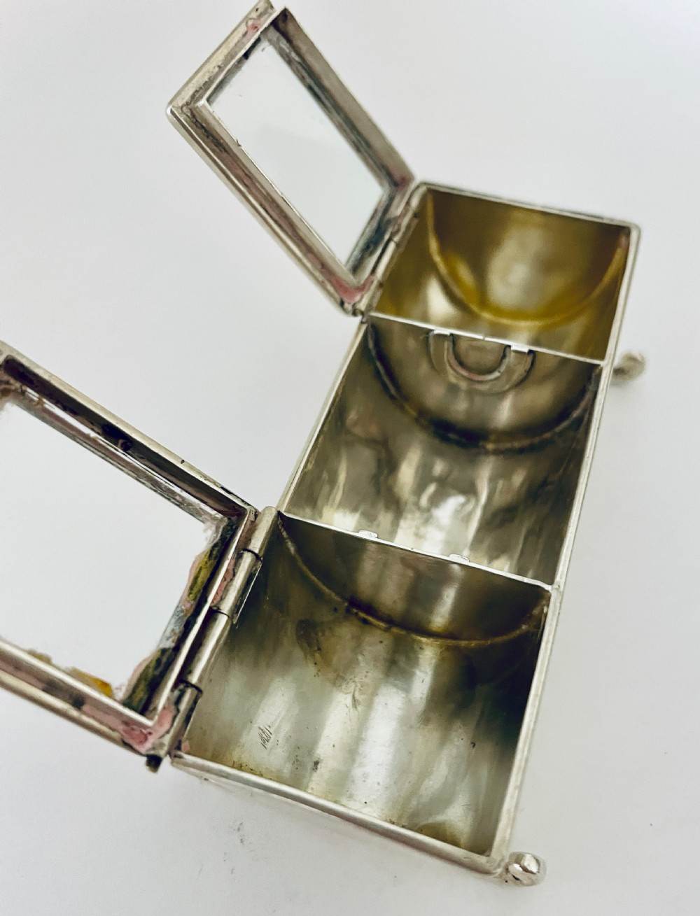 A rectangular Victorian silver double stamp trough with an engraved monogram, raised on four scrolled legs with two glass-topped compartments. View XI