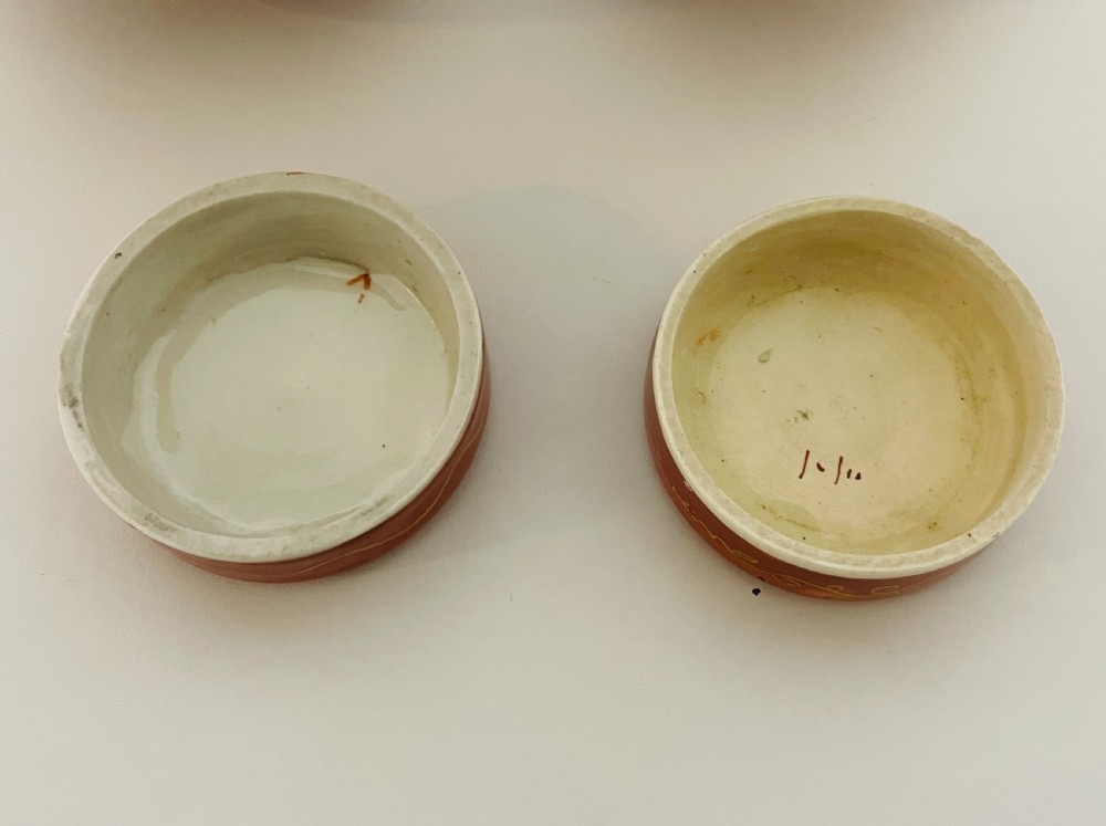 A pair of Japanese Kutani porcelain ginger jars decorated with iron-red hand-painted figures of children playing beneath decorative cloud and leaf borders. View XIII