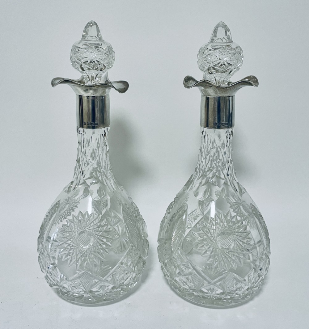 Pair of Silver Mounted Cut Glass Decanters