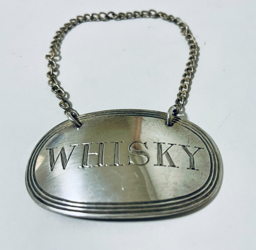 Antique Silver Whisky Label
 View II